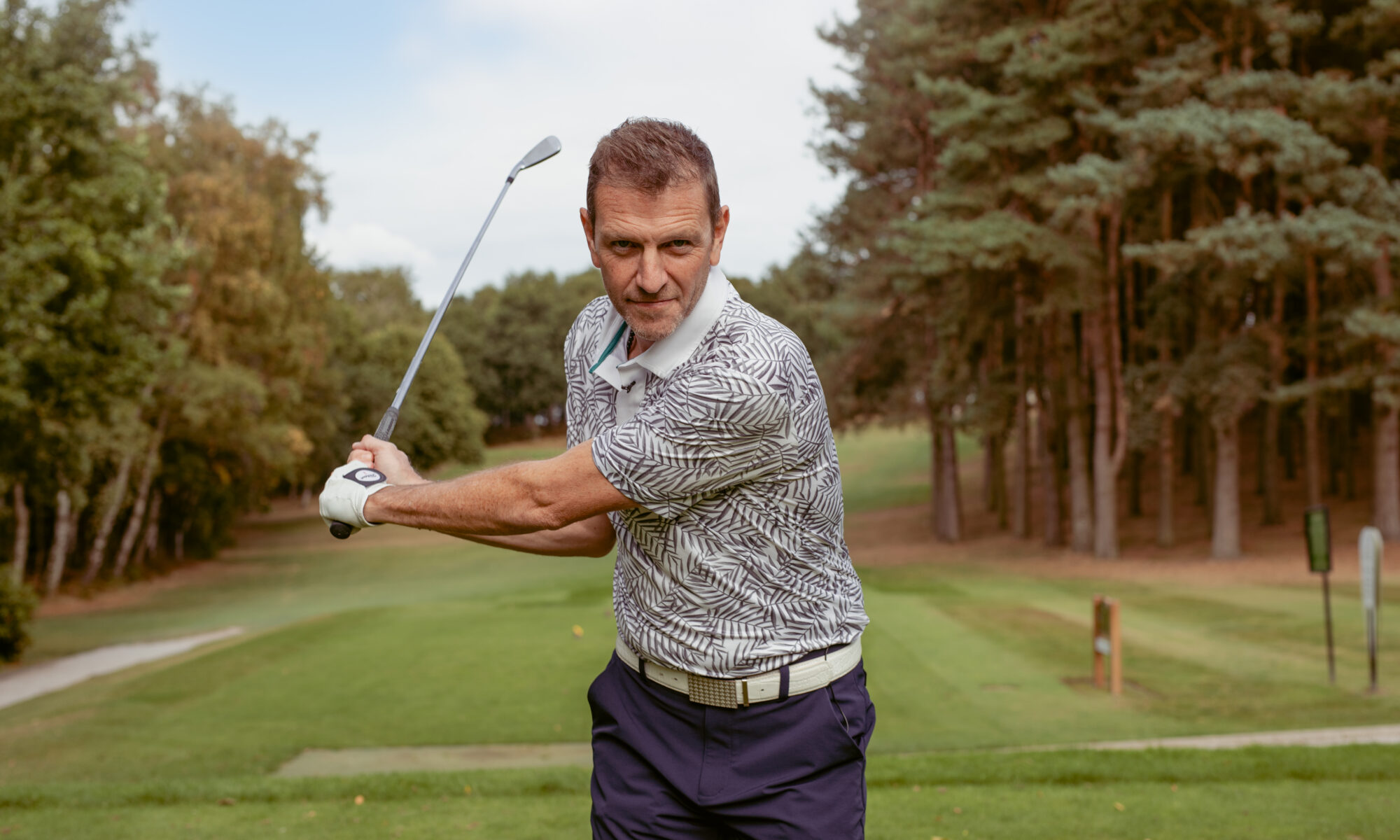 Lee Sharpe swinging golf club on Golf Course